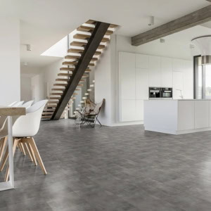 Modern kitchen with floating staircase and minimalist decor
